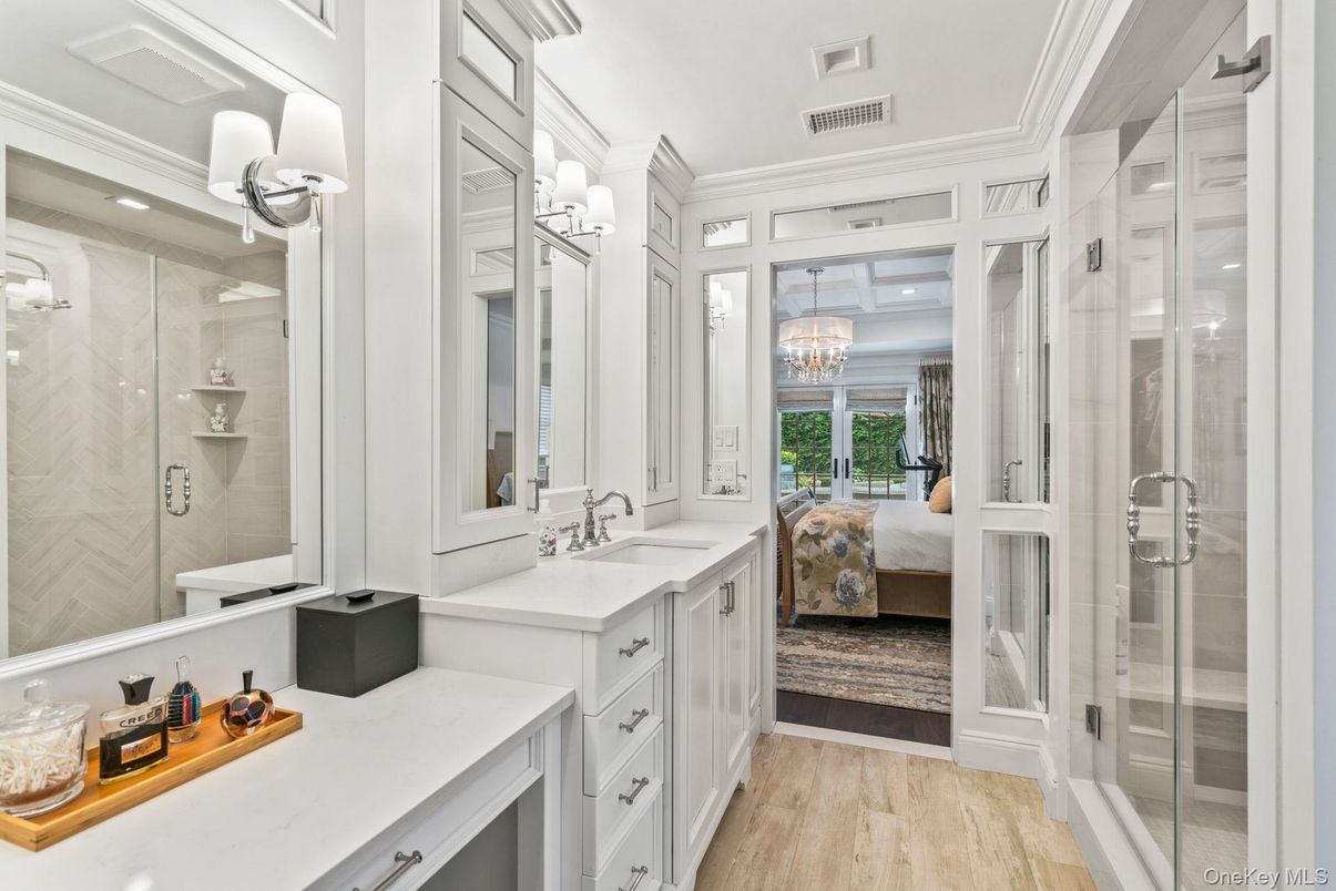 Bathroom, Bedroom, Chandelier, Dual Sink Vanities, Glass Shower, Interior, Recessed Lighting, Wood Texture Flooring