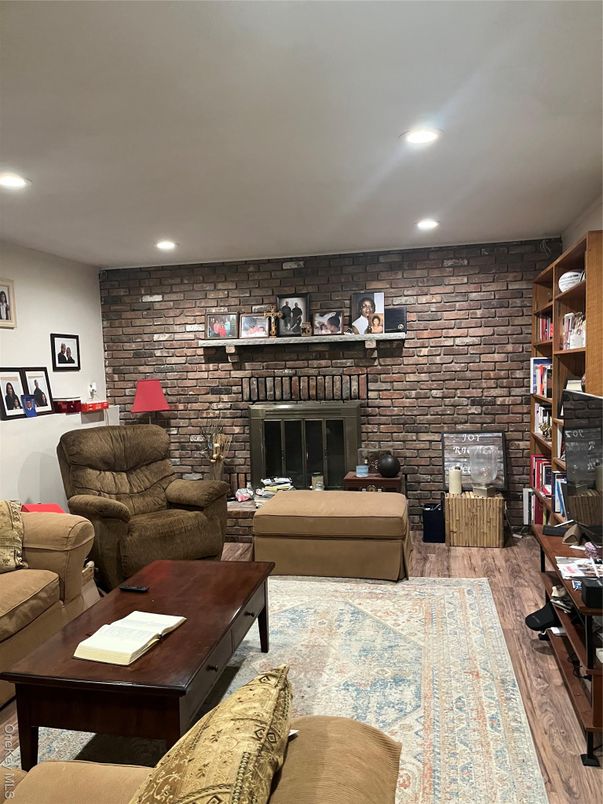 Fireplace, Interior, Living room, Recessed Lighting, Stone Walls, Wood Texture Flooring