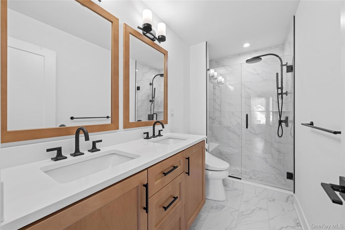 Bathroom, Dual Sink Vanities, Glass Shower, Interior, Marble, Marble Walls, Recessed Lighting