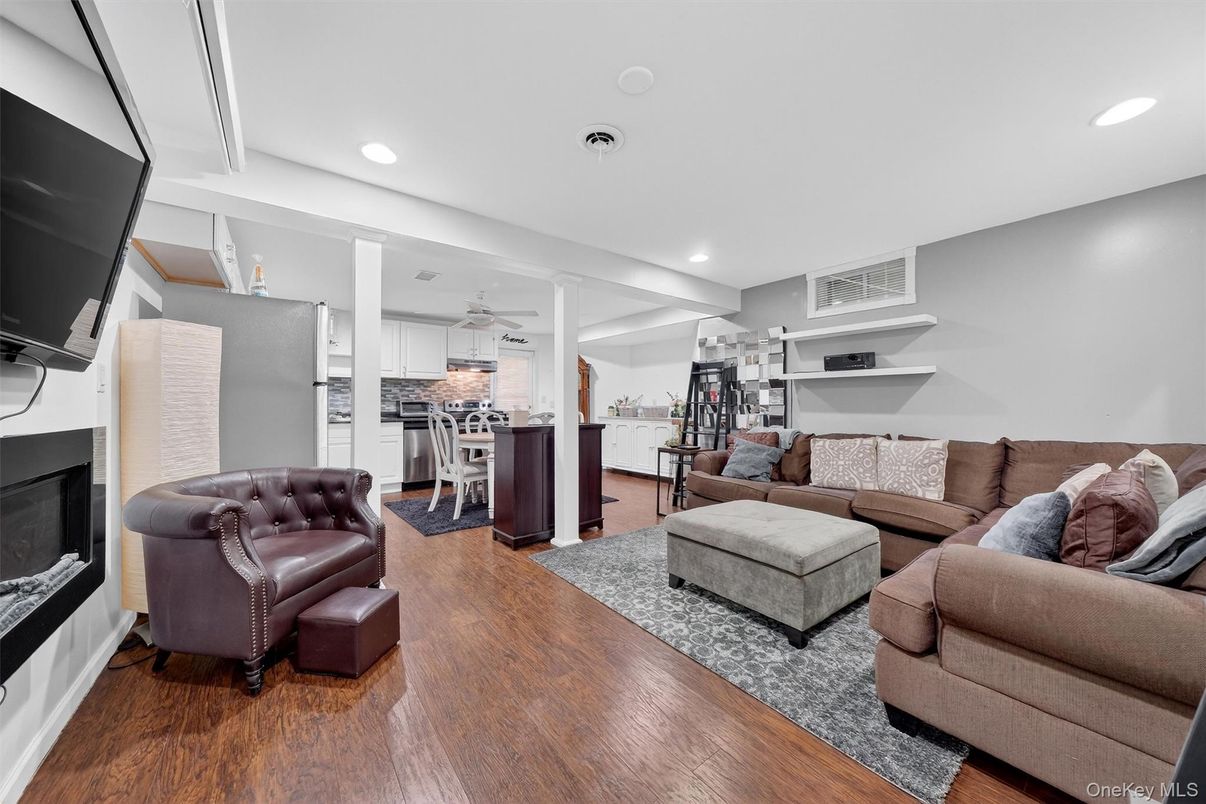 Fireplace, Interior, Kitchen, Living room, Recessed Lighting, Stainless Steel Appliances, Wood Texture Flooring