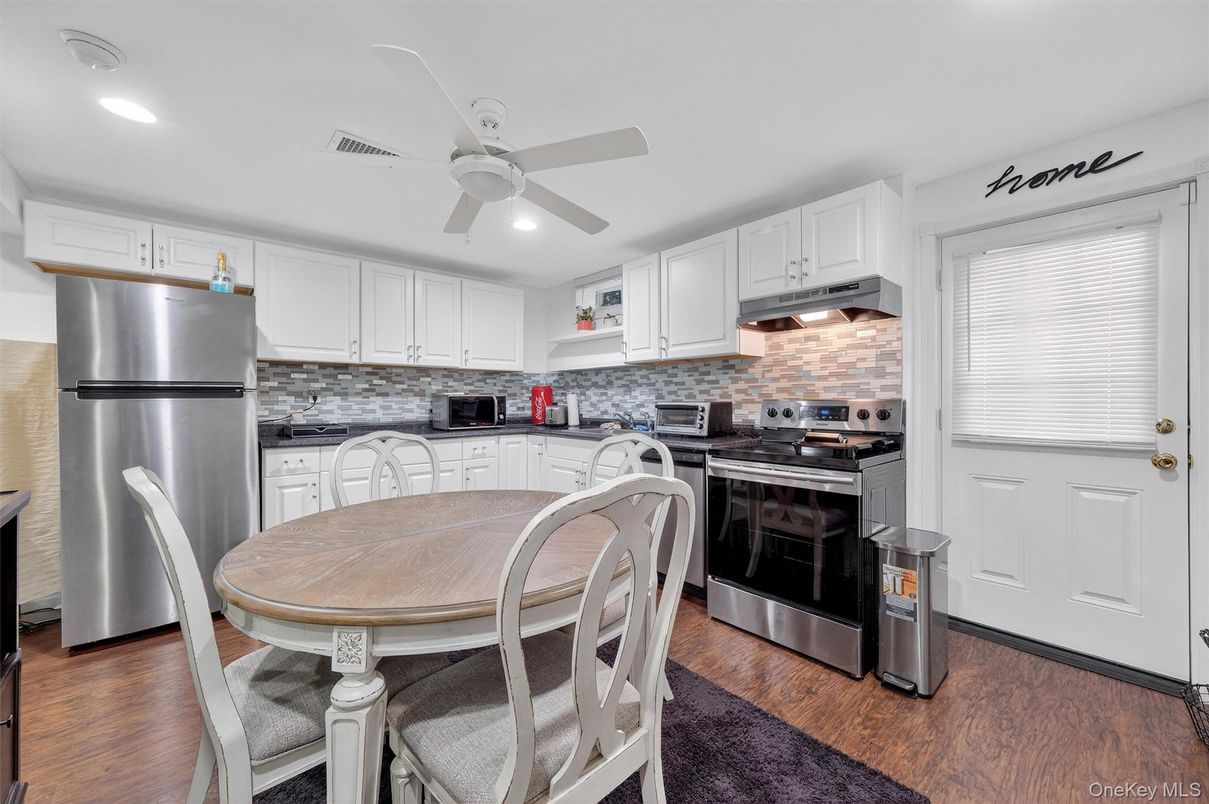 Dining room, Interior, Kitchen, Recessed Lighting, Stainless Steel Appliances, Stone Walls, Wood Texture Flooring