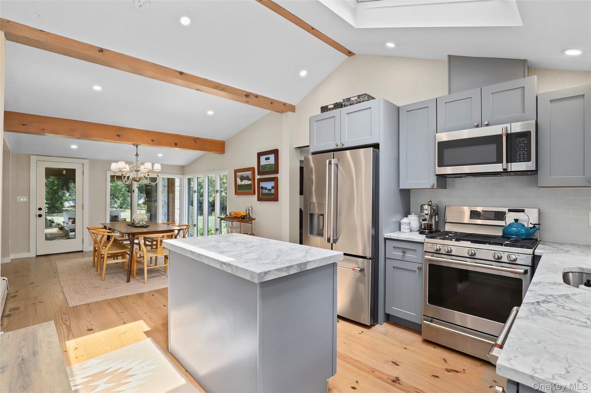 Chandelier, Dining room, Interior, Kitchen, Recessed Lighting, Stainless Steel Appliances, Wooden Beams, Wood Texture Flooring