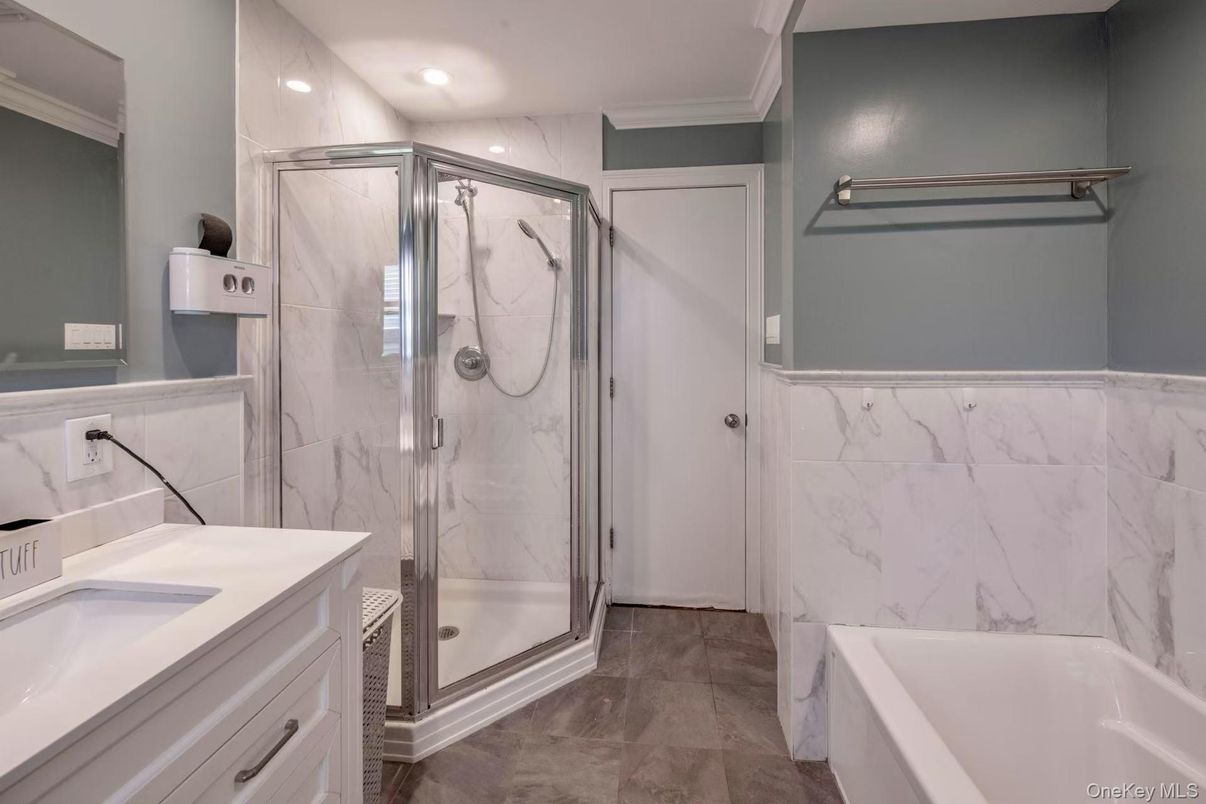 Bathroom, Dual Sink Vanities, Glass Shower, Interior, Marble Walls, Recessed Lighting