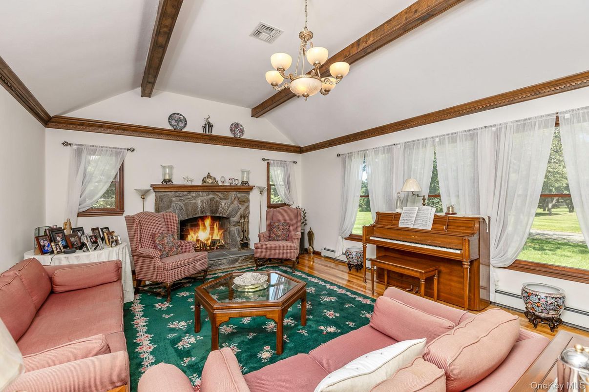Chandelier, Fireplace, Interior, Living room, Piano, Wooden Beams, Wood Texture Flooring