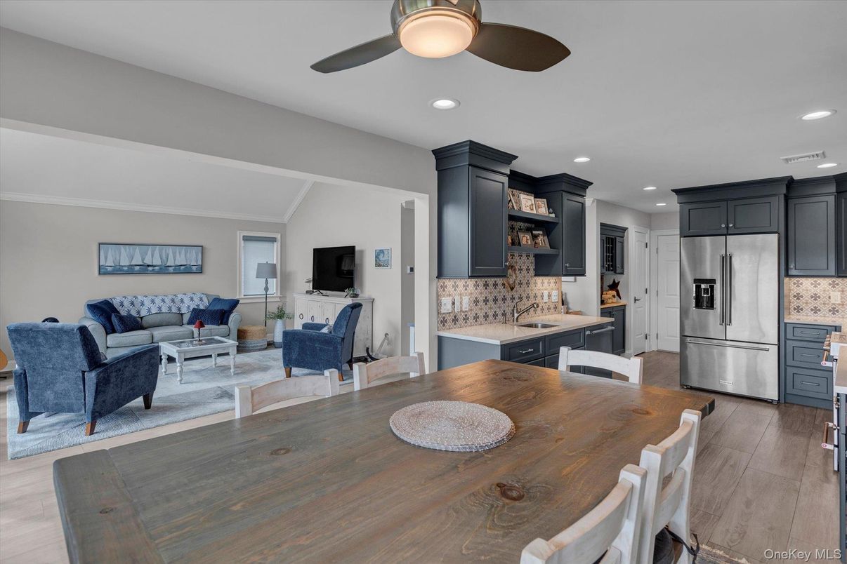 Dining room, Interior, Kitchen, Living room, Recessed Lighting, Stainless Steel Appliances, Wood Texture Flooring