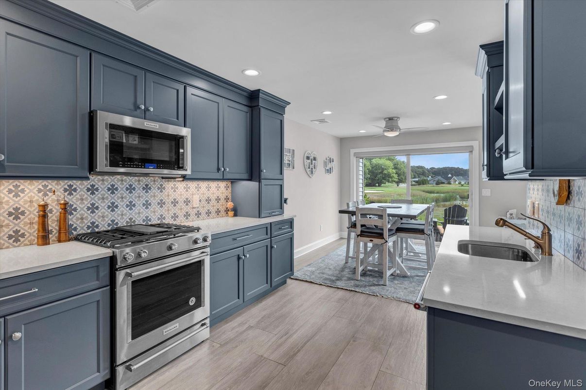 Dining room, Interior, Kitchen, Recessed Lighting, Stainless Steel Appliances, Wood Texture Flooring