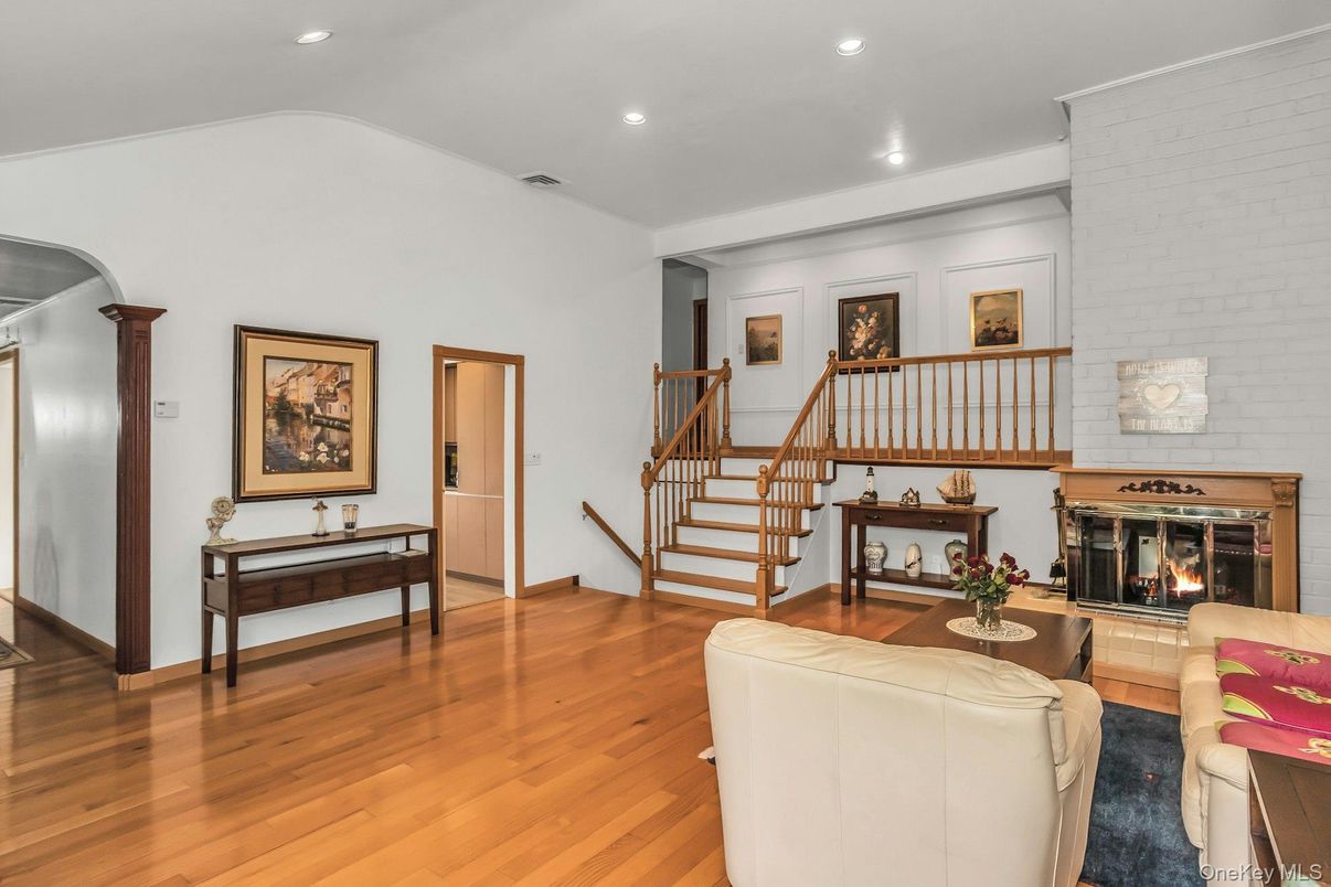 Fireplace, Interior, Living room, Recessed Lighting, Stone Walls, Wood Texture Flooring