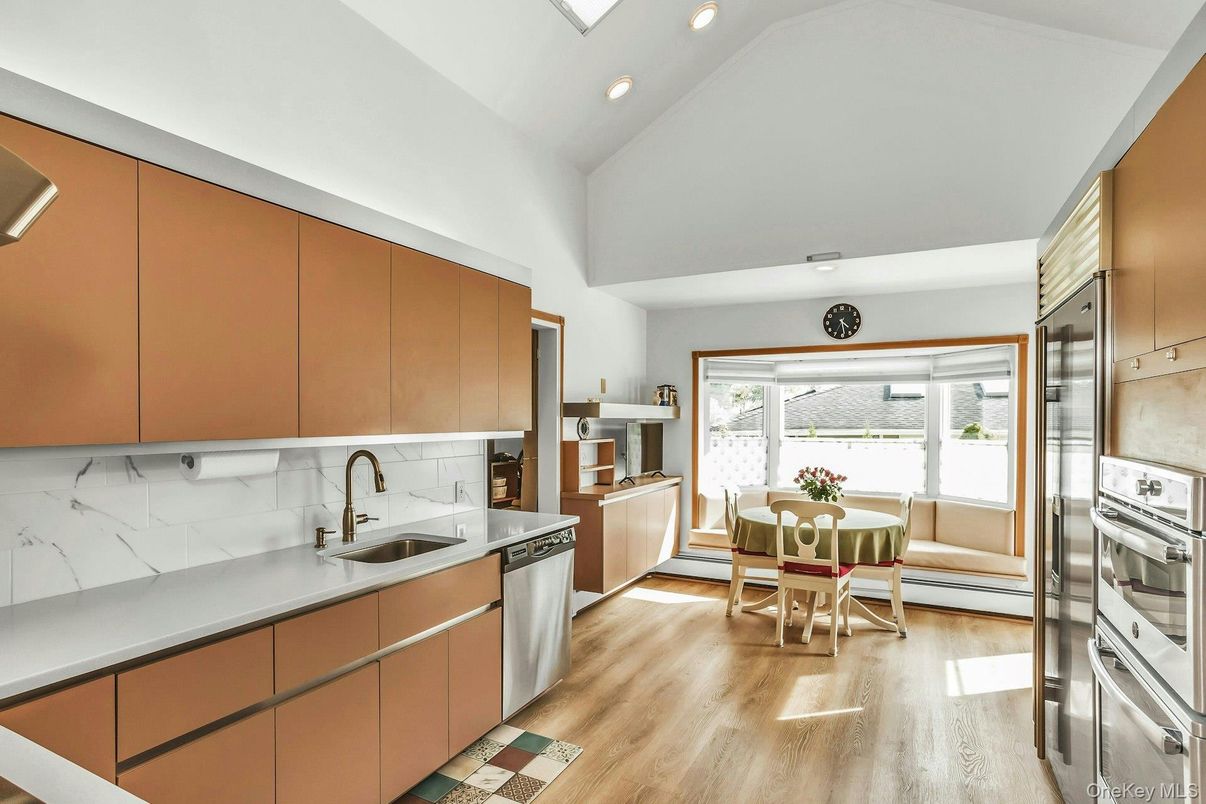 Dining room, Interior, Kitchen, Recessed Lighting, Stainless Steel Appliances, Wood Texture Flooring