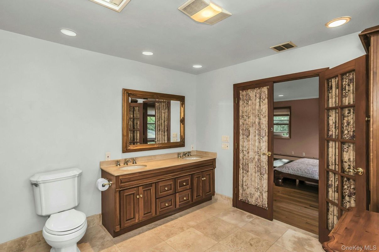 Bathroom, Dual Sink Vanities, Interior, Recessed Lighting, Wood Texture Flooring