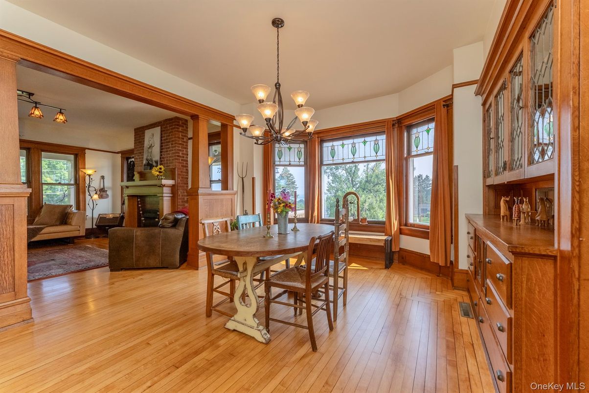 Chandelier, Dining room, Fireplace, Interior, Living room, Stone Walls, Wood Texture Flooring