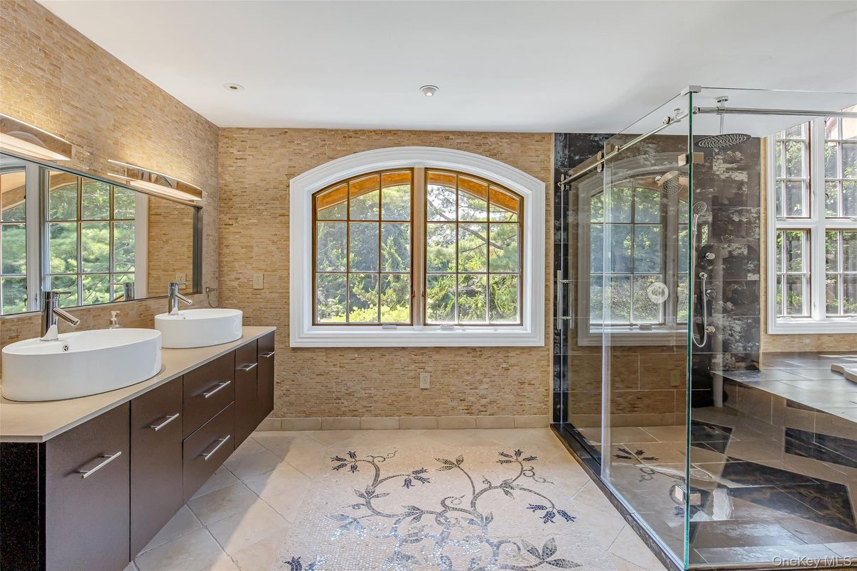 Bathroom, Dual Sink Vanities, Glass Shower, Interior, Recessed Lighting, Stone Walls