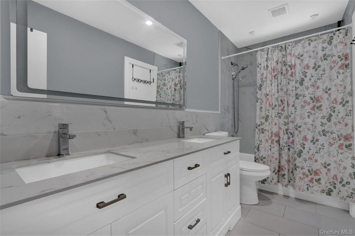 Bathroom, Dual Sink Vanities, Interior, Marble Walls, Recessed Lighting