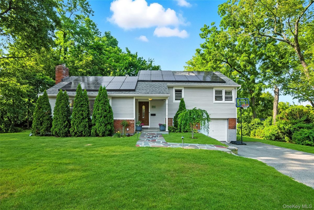 Attached, Backyard, Exterior, Facade, Solar Panels, Raised Ranch