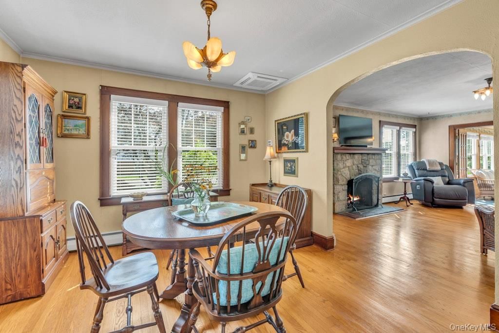 Dining room, Fireplace, Interior, Pendant Lights, Wood Texture Flooring