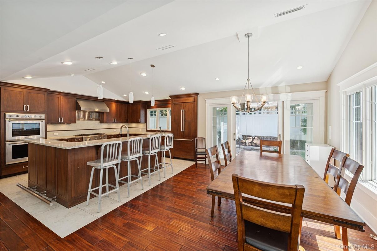 Chandelier, Dining room, Interior, Kitchen, Pendant Lights, Recessed Lighting, Stainless Steel Appliances, Wood Texture Flooring