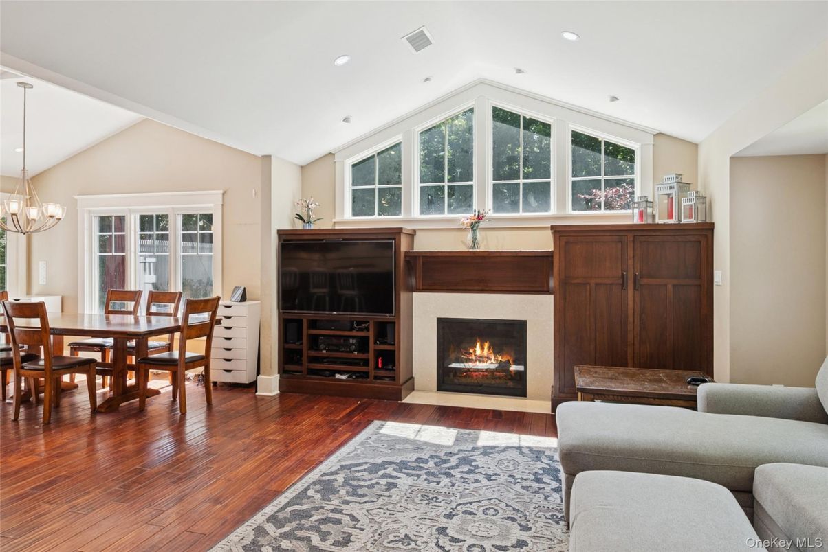 Chandelier, Dining room, Fireplace, Interior, Living room, Recessed Lighting, Wood Texture Flooring