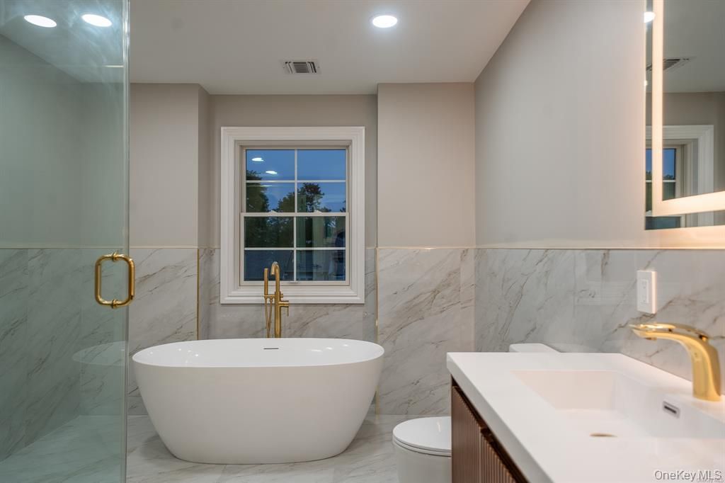 Bathroom, Free Standing Baths, Glass Shower, Interior, Marble, Marble Walls, Recessed Lighting