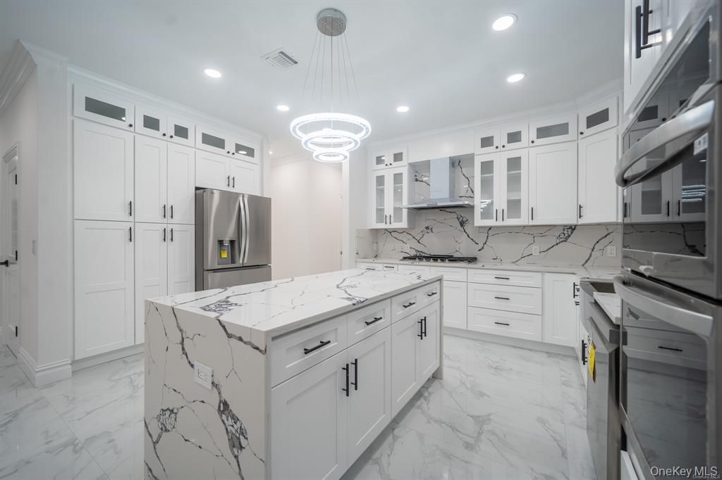 Interior, Kitchen, Marble, Marble Walls, Pendant Lights, Recessed Lighting, Stainless Steel Appliances
