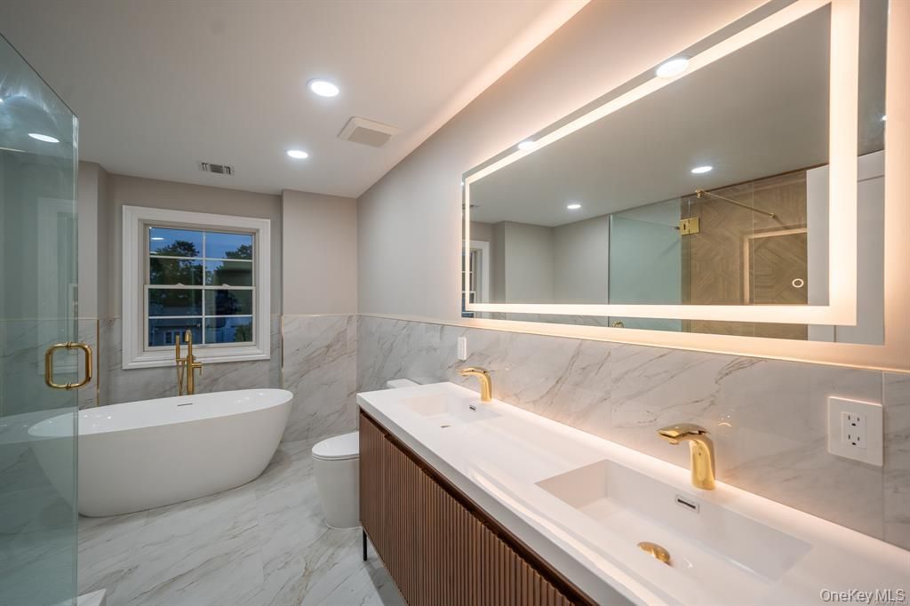 Bathroom, Dual Sink Vanities, Free Standing Baths, Glass Shower, Interior, Marble, Marble Walls, Recessed Lighting
