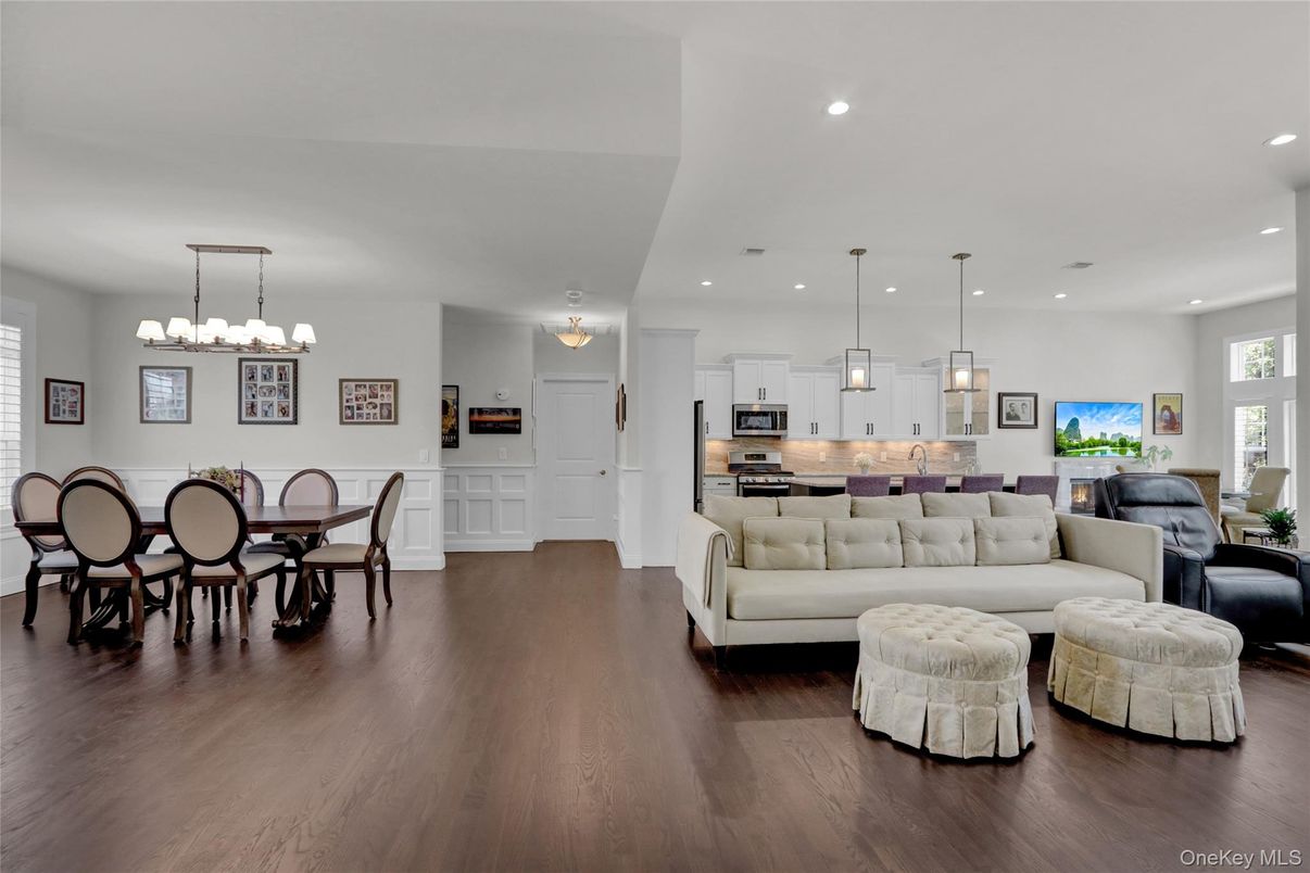 Chandelier, Dining room, Interior, Kitchen, Living room, Pendant Lights, Recessed Lighting, Stainless Steel Appliances, Wood Texture Flooring