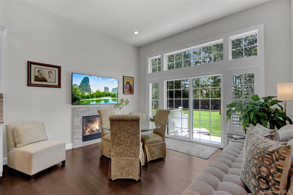Dining room, Fireplace, Interior, Living room, Recessed Lighting, Wood Texture Flooring