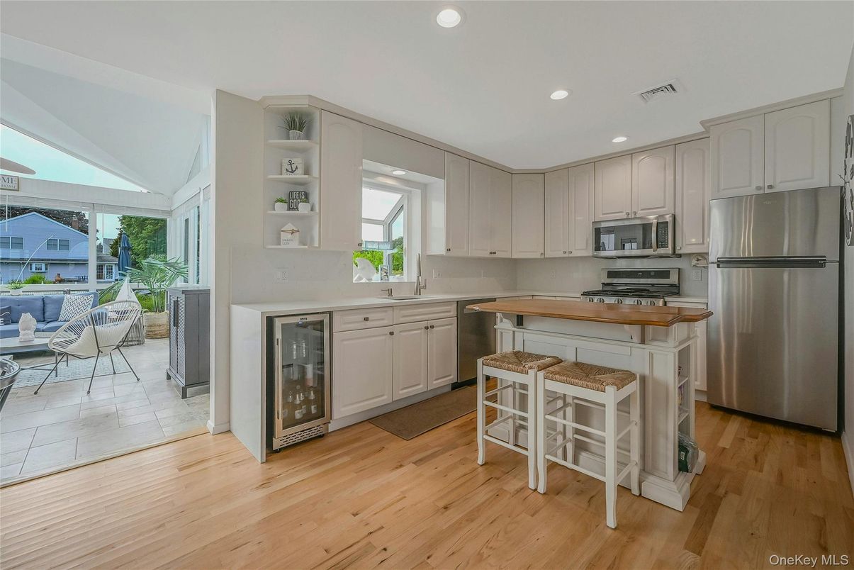 Dining room, Interior, Kitchen, Recessed Lighting, Stainless Steel Appliances, Wood Texture Flooring