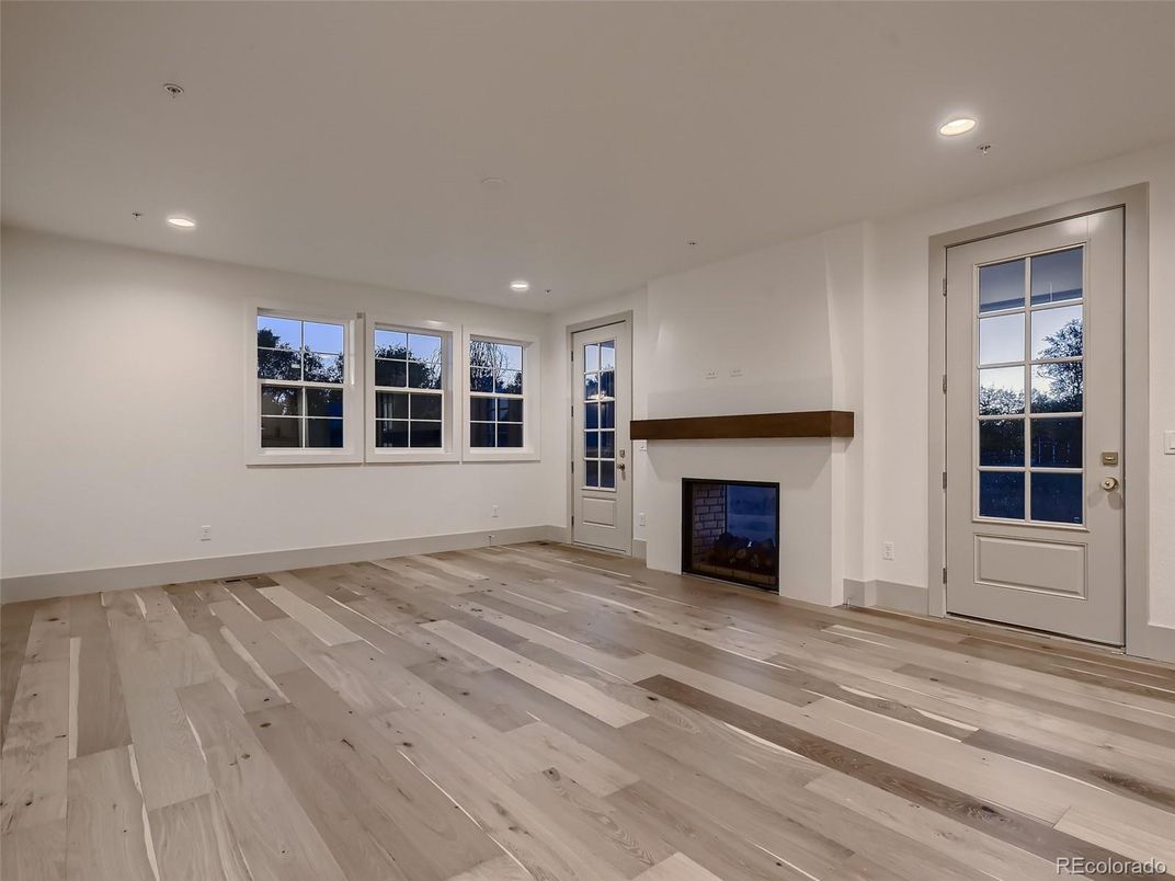 Empty room, Fireplace, Interior, Recessed Lighting, Wood Texture Flooring