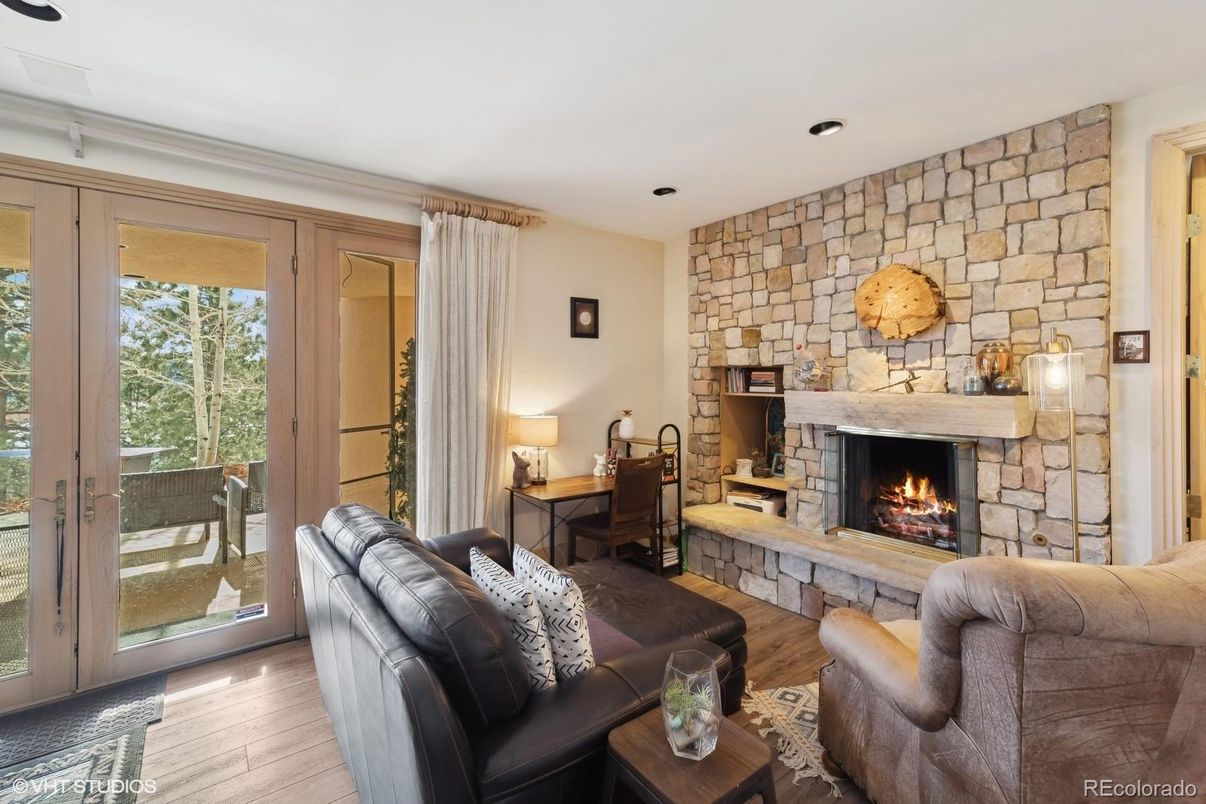 Fireplace, Interior, Living room, Recessed Lighting, Stone Walls, Wood Texture Flooring