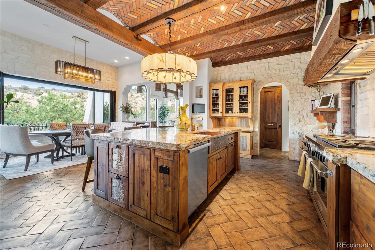 Chandelier, Dining room, Interior, Kitchen, Pendant Lights, Recessed Lighting, Stainless Steel Appliances, Stone Walls, Wooden Beams, Wooden Ceilings