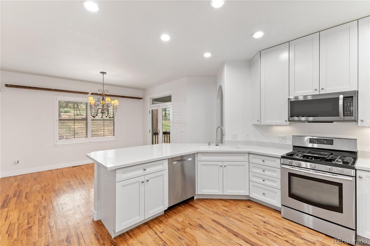 Chandelier, Interior, Kitchen, Recessed Lighting, Stainless Steel Appliances, Wood Texture Flooring