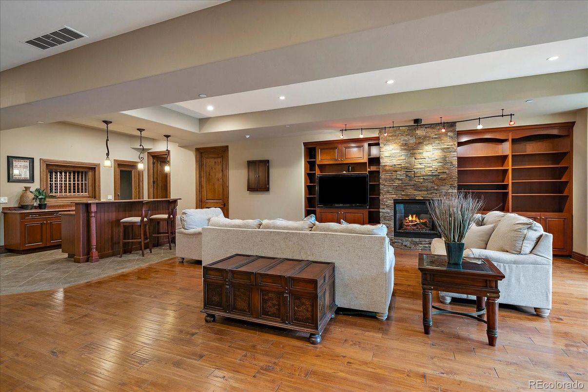 Fireplace, Interior, Living room, Pendant Lights, Recessed Lighting, Stone Walls, Wood Texture Flooring