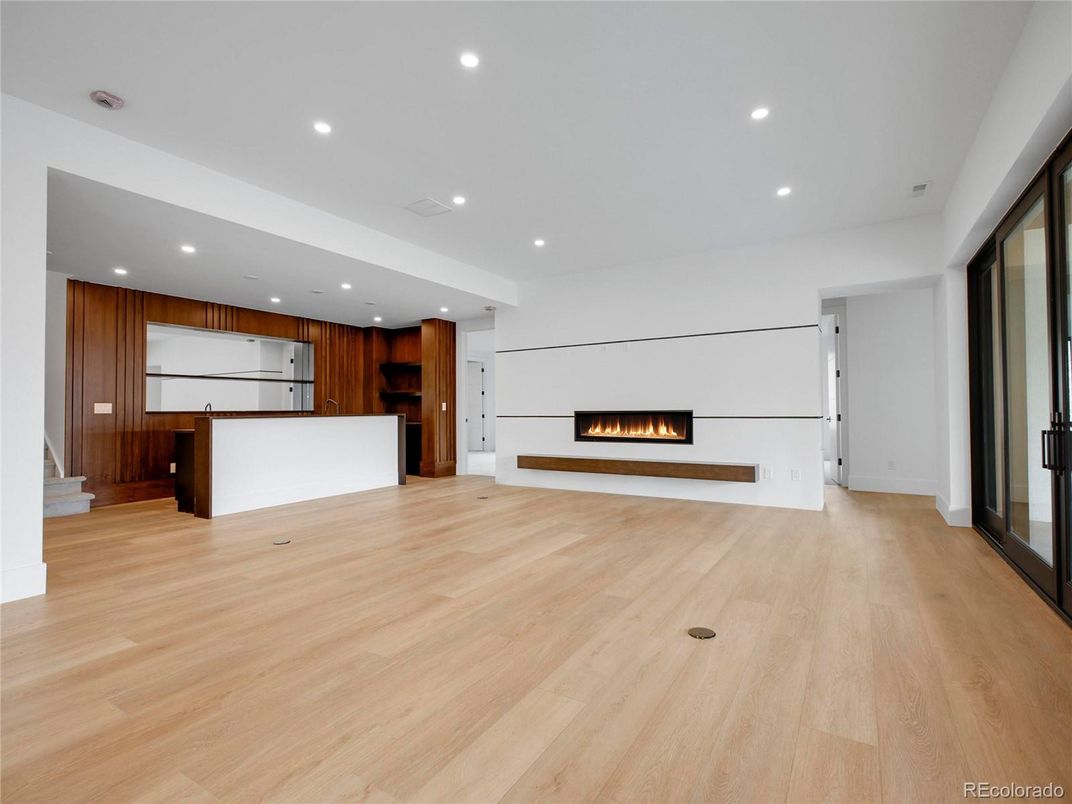 Empty room, Fireplace, Interior, Kitchen, Recessed Lighting, Wood Texture Flooring