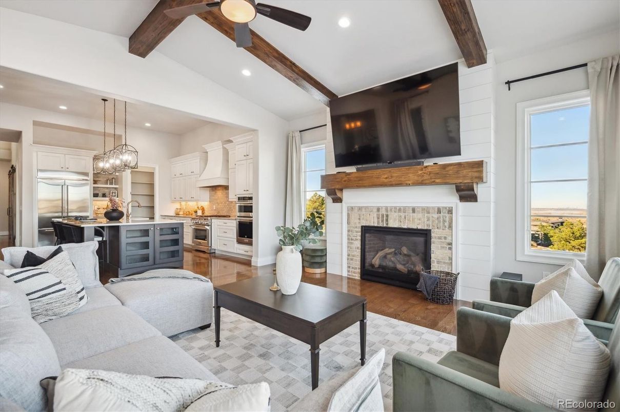 Fireplace, Interior, Kitchen, Living room, Pendant Lights, Recessed Lighting, Stainless Steel Appliances, Wooden Beams, Wood Texture Flooring