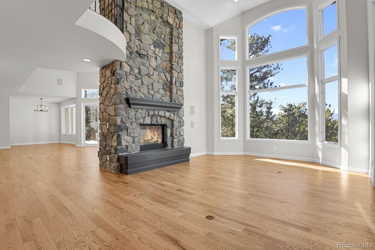 Empty room, Fireplace, Interior, Recessed Lighting, Stone Walls, Wood Texture Flooring