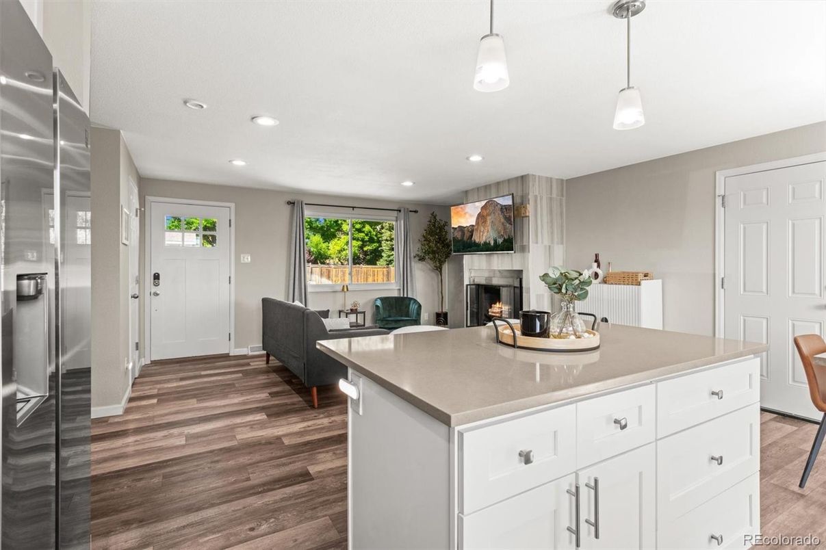 Fireplace, Interior, Kitchen, Pendant Lights, Recessed Lighting, Stainless Steel Appliances, Wood Texture Flooring