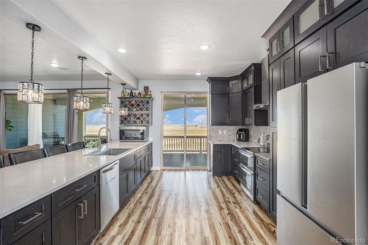 Fireplace, Interior, Kitchen, Pendant Lights, Recessed Lighting, Stainless Steel Appliances, Wood Texture Flooring
