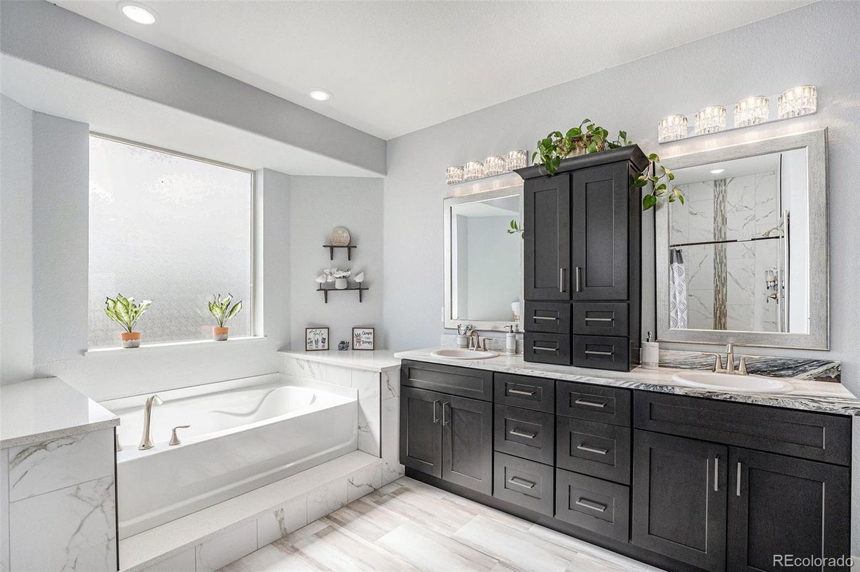 Bathroom, Dual Sink Vanities, Interior, Marble Walls, Recessed Lighting, Wood Texture Flooring