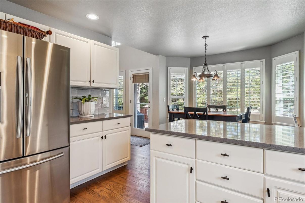 Dining room, Interior, Kitchen, Pendant Lights, Recessed Lighting, Stainless Steel Appliances, Wood Texture Flooring