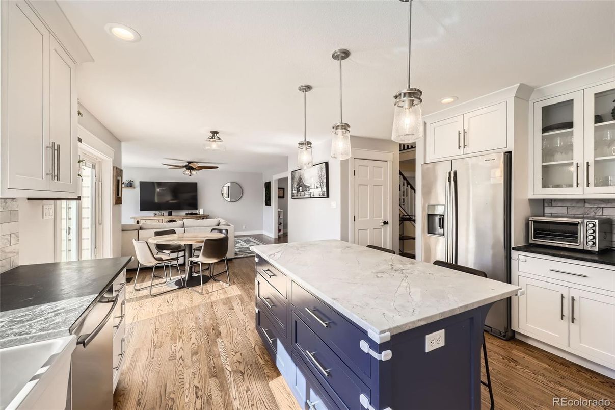 Dining room, Interior, Kitchen, Pendant Lights, Recessed Lighting, Stainless Steel Appliances, Wood Texture Flooring