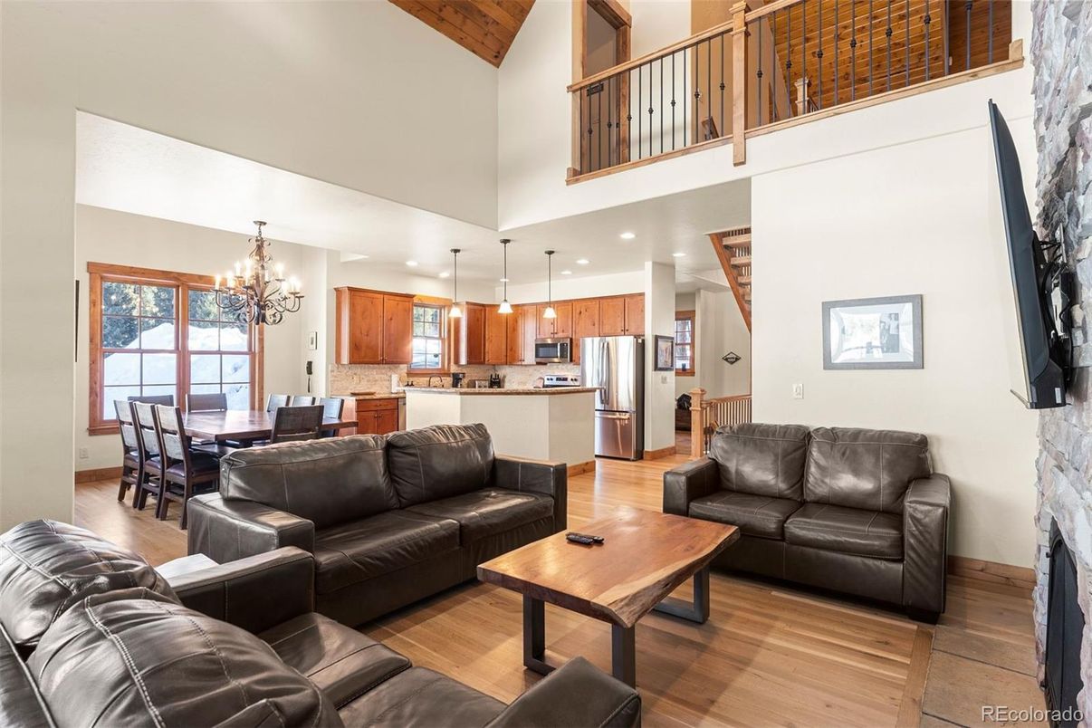 Chandelier, Dining room, Interior, Kitchen, Living room, Pendant Lights, Recessed Lighting, Stainless Steel Appliances, Wood Texture Flooring