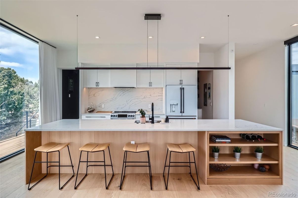 Interior, Kitchen, Marble Walls, Pendant Lights, Recessed Lighting, Stainless Steel Appliances, Wood Texture Flooring