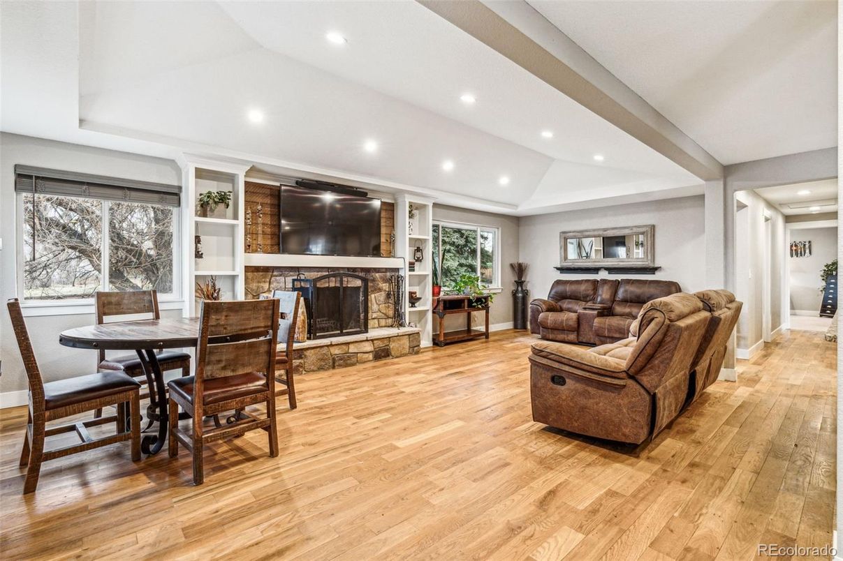 Dining room, Fireplace, Interior, Living room, Recessed Lighting, Wood Texture Flooring