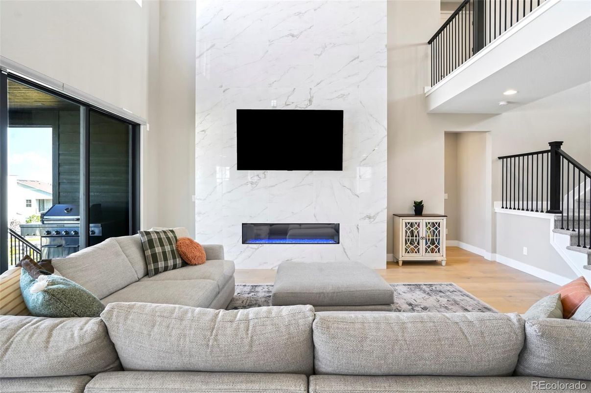 Fireplace, Interior, Living room, Marble Walls, Recessed Lighting, Wood Texture Flooring