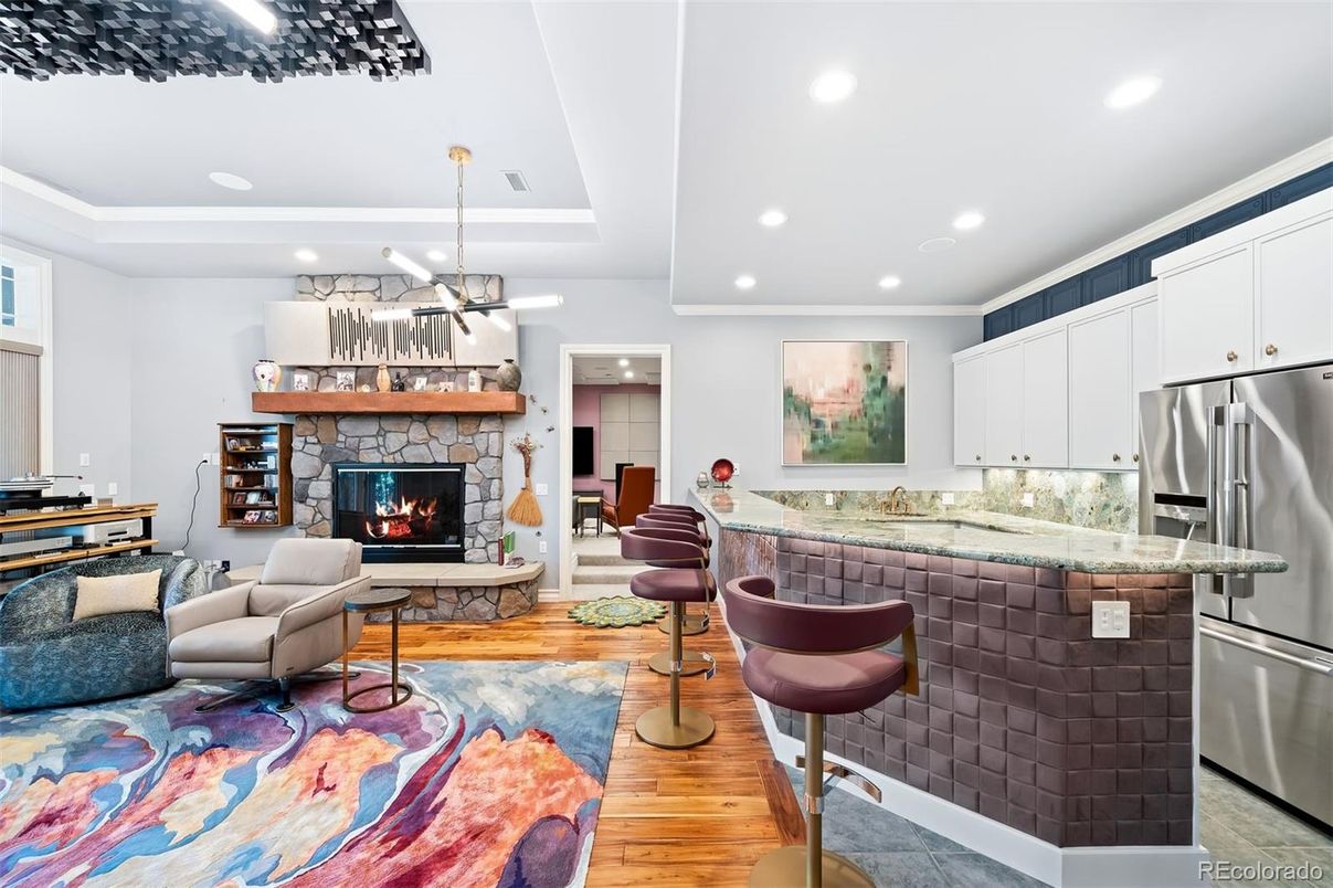 Fireplace, Interior, Kitchen, Living room, Pendant Lights, Recessed Lighting, Stainless Steel Appliances, Wood Texture Flooring
