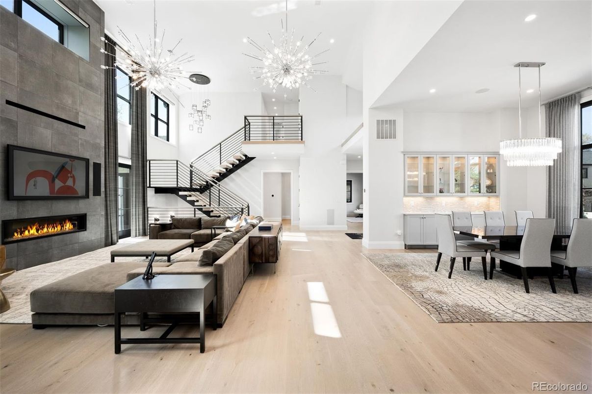 Chandelier, Dining room, Fireplace, Interior, Living room, Pendant Lights, Recessed Lighting, Wood Texture Flooring