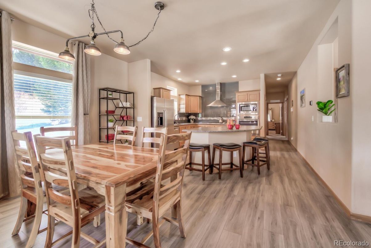 Dining room, Interior, Kitchen, Pendant Lights, Recessed Lighting, Stainless Steel Appliances, Wood Texture Flooring
