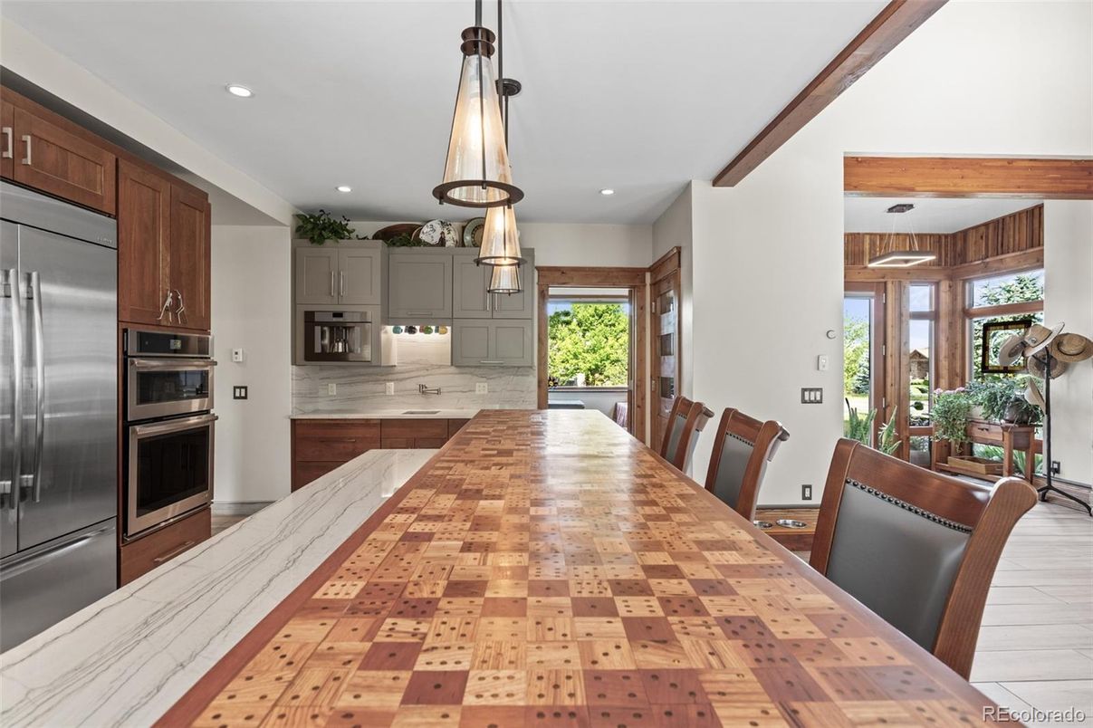 Dining room, Interior, Kitchen, Pendant Lights, Recessed Lighting, Stainless Steel Appliances, Wood Texture Flooring