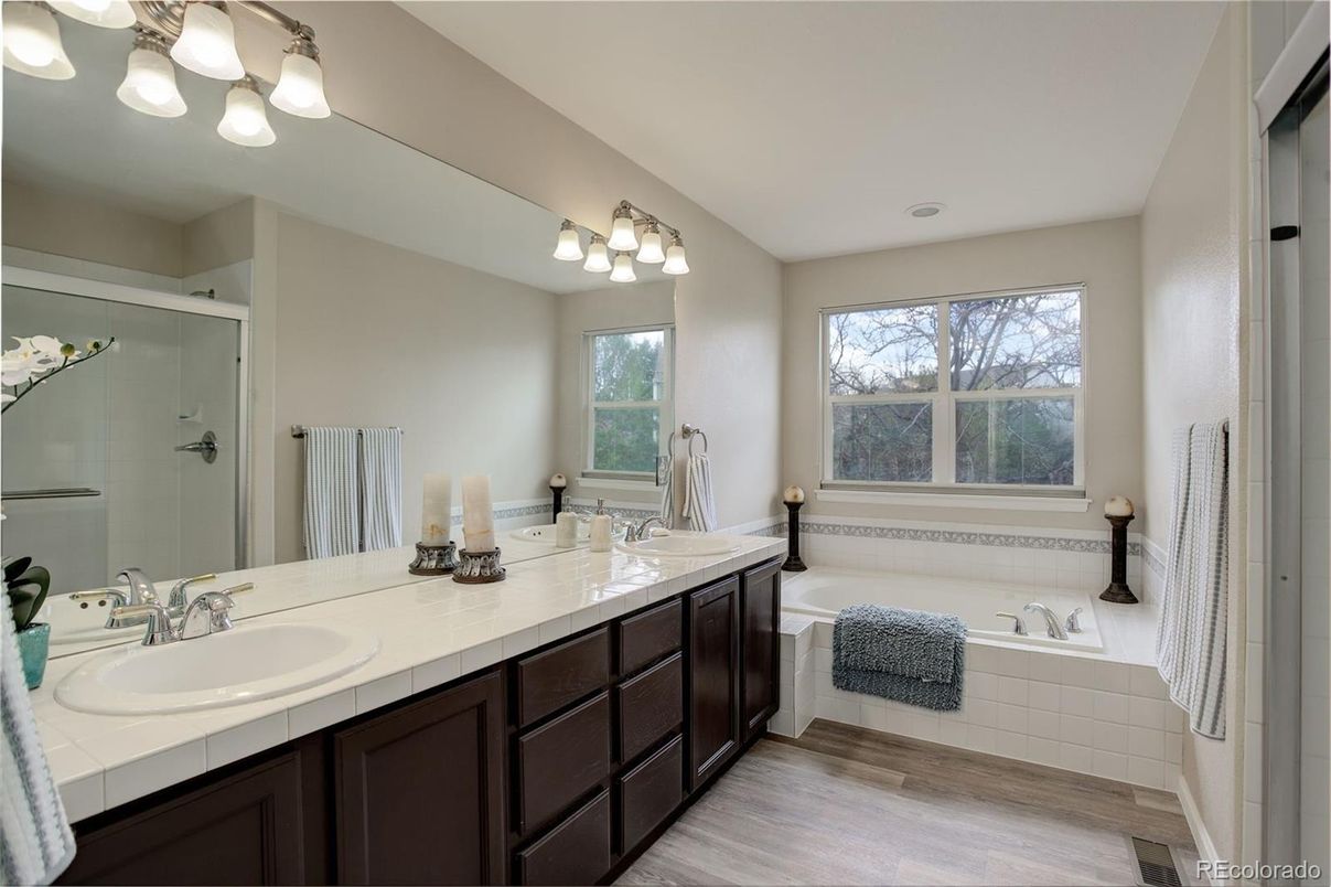 Bathroom, Dual Sink Vanities, Glass Shower, Interior, Tile Countertops, Wood Texture Flooring