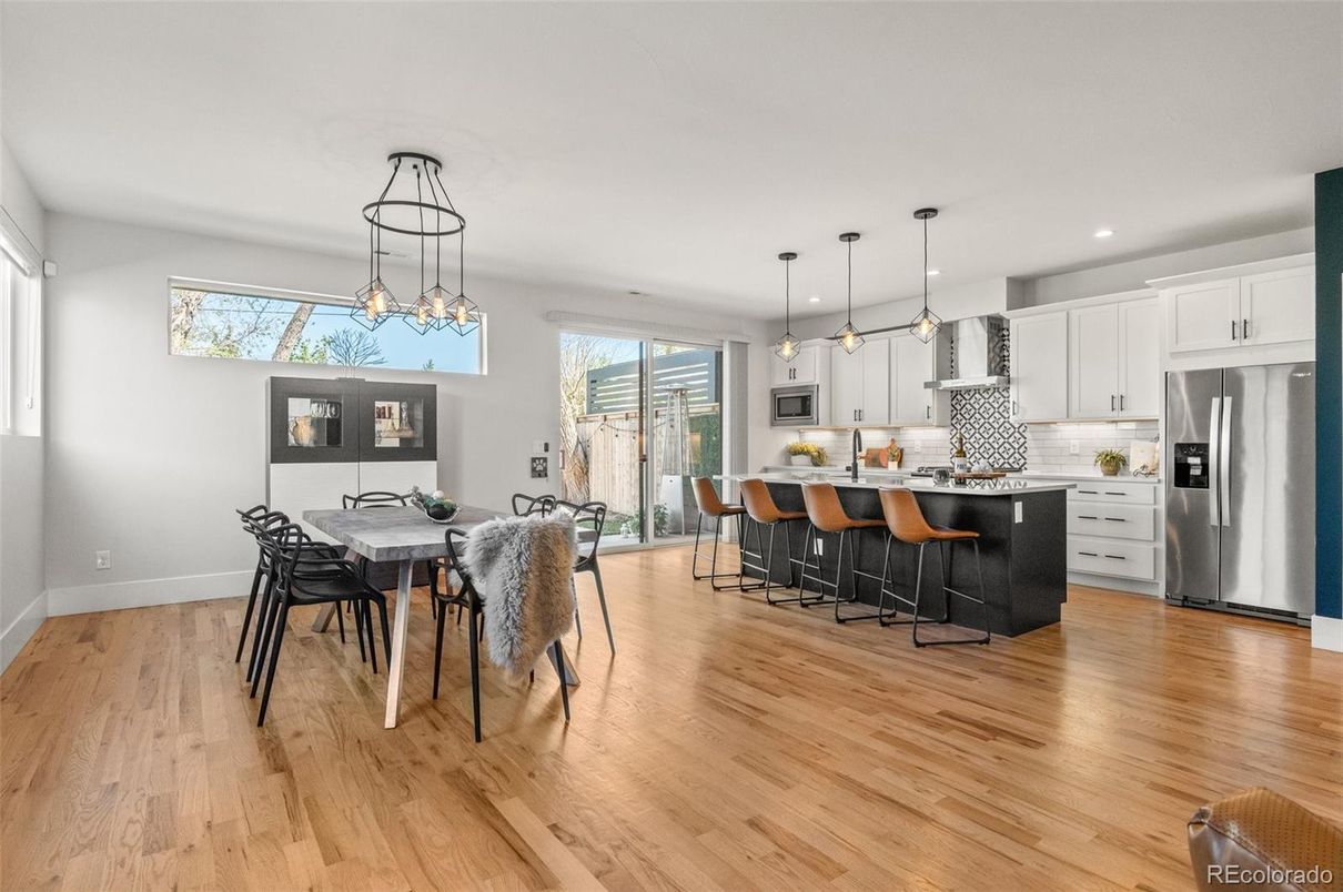 Dining room, Interior, Kitchen, Pendant Lights, Recessed Lighting, Stainless Steel Appliances, Wood Texture Flooring