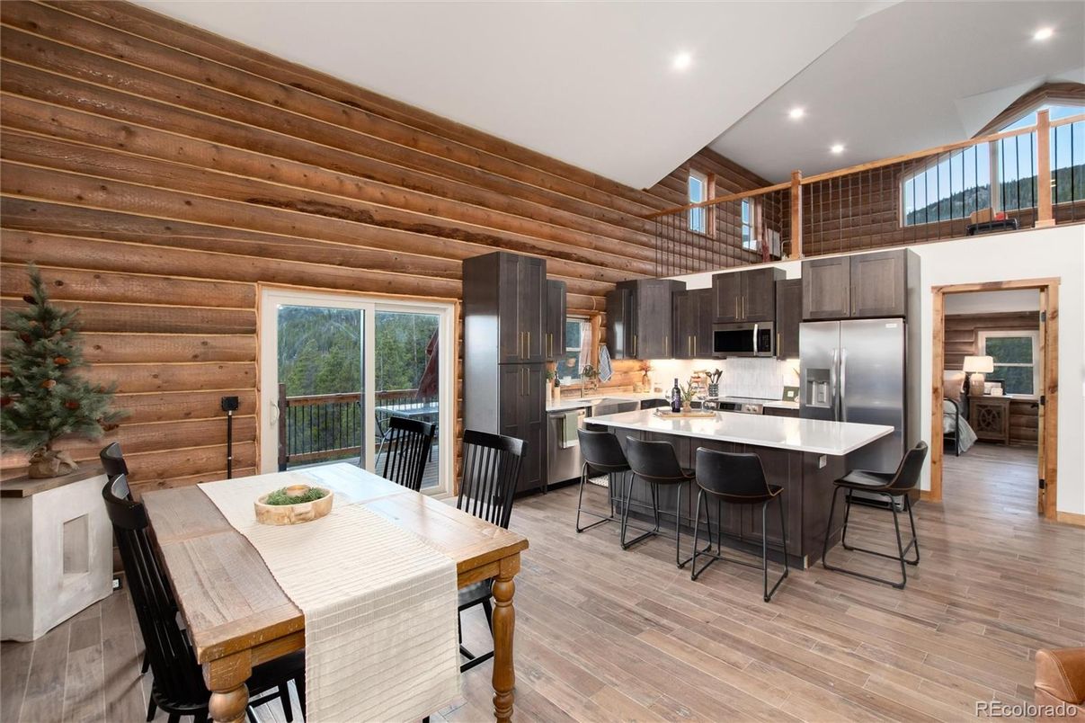 Dining room, Interior, Kitchen, Recessed Lighting, Stainless Steel Appliances, Wood Texture Flooring, Wooden Walls